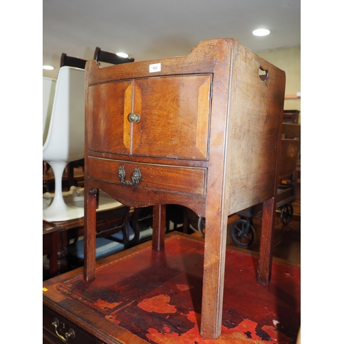 568 - A 19th century mahogany tray top bowfront washstand, enclosed two doors over one drawer, on moulded ... 