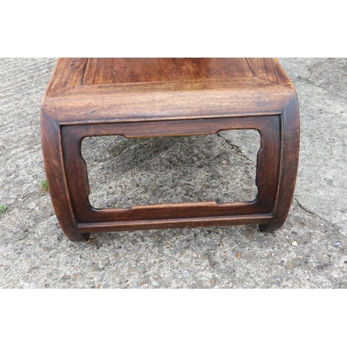 575 - A Chinese carved hardwood low table, on scroll end supports, 37