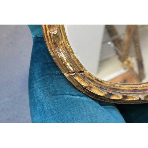 596 - A 19th century oval gilt framed wall mirror, and another gilt framed oval wall mirror