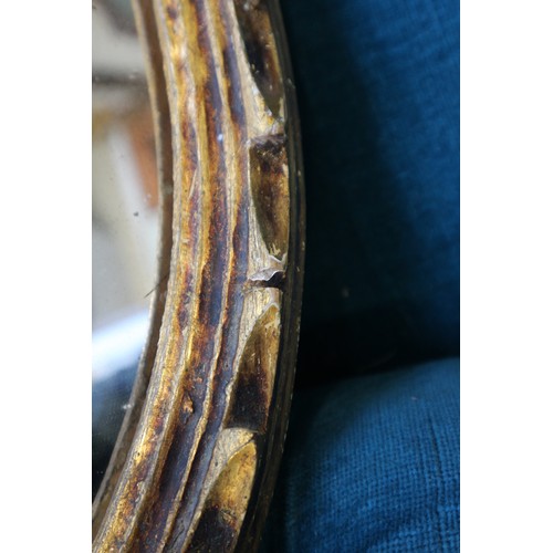 596 - A 19th century oval gilt framed wall mirror, and another gilt framed oval wall mirror