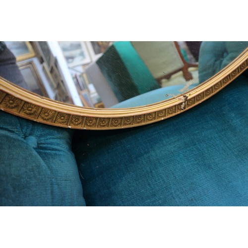 596 - A 19th century oval gilt framed wall mirror, and another gilt framed oval wall mirror