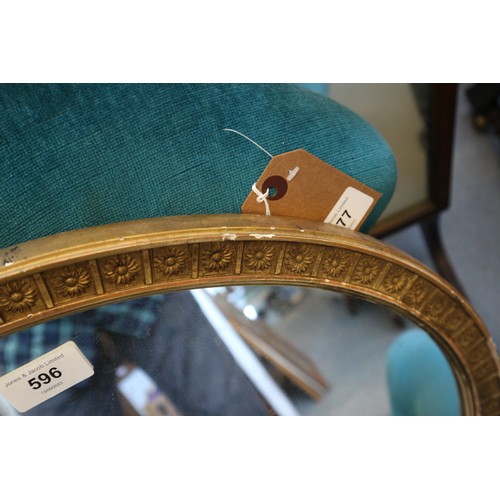 596 - A 19th century oval gilt framed wall mirror, and another gilt framed oval wall mirror