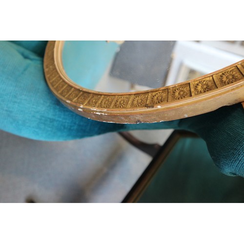 596 - A 19th century oval gilt framed wall mirror, and another gilt framed oval wall mirror