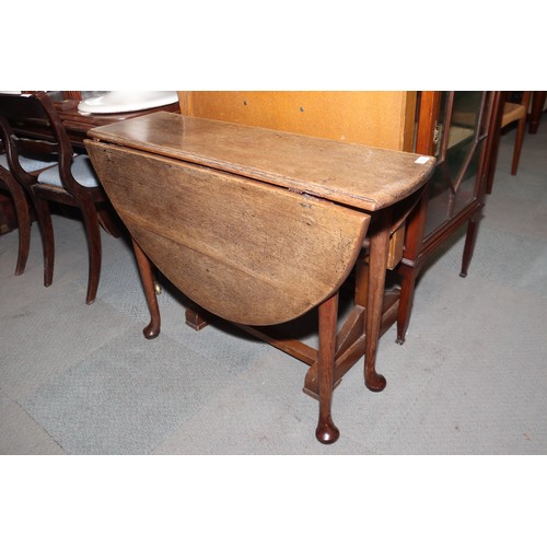 554 - A largely Georgian provincial oak and drop leaf dining table, fitted drawer, on pole turned supports... 