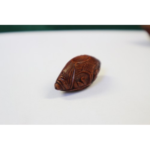 105 - A Chinese Hediao carved nut, formed as boat with figures, with retractable windows and verse to base... 