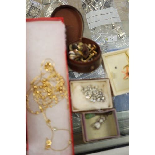 404 - A quantity of costume jewellery, including brooches, two pins, shirt studs, various white metal and ... 