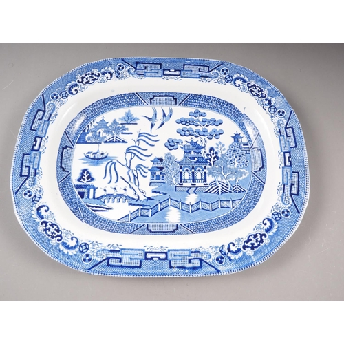 11 - A blue and white willow pattern meat plate, 18