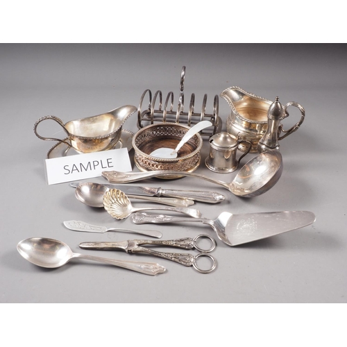 137 - A selection of silver plated flatware, a pair of silver bottle coasters, a plated pepper grinder, a ... 