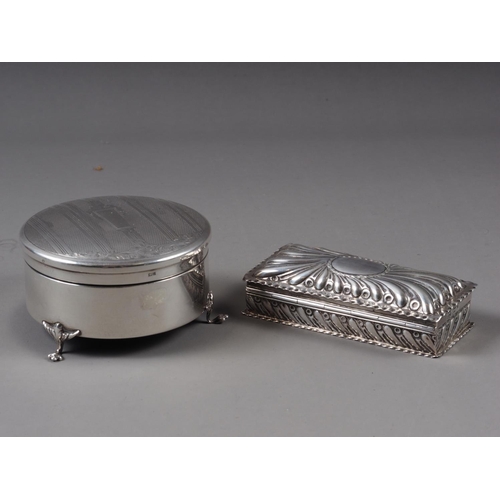 152 - A circular silver dressing table box, with engine turned decoration, and a rectangular silver box, w... 