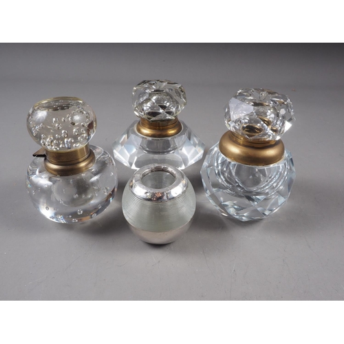 24 - Three cut glass inkwells and a silver mounted vesta striker