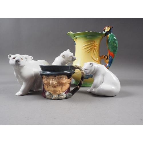 27 - Four Lladro polar bear figures, a Burleigh ware jug with parrot handle and a Royal Doulton Tony Mell... 