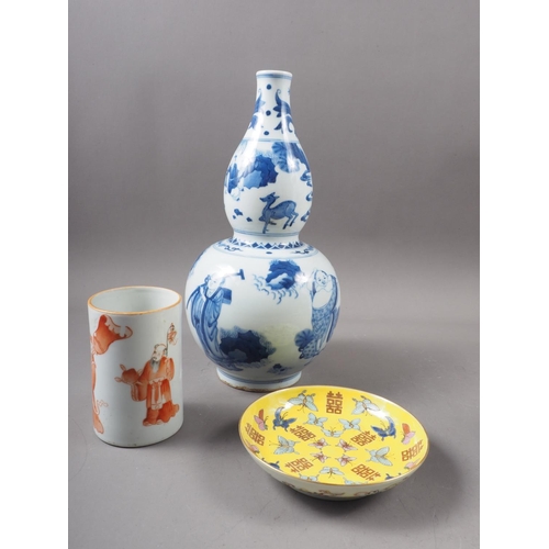 50 - A large selection of Chinese ceramics, wood stands, etc