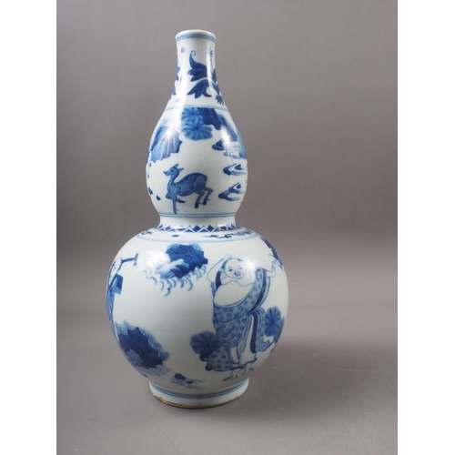 50 - A large selection of Chinese ceramics, wood stands, etc