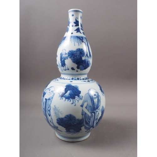 50 - A large selection of Chinese ceramics, wood stands, etc