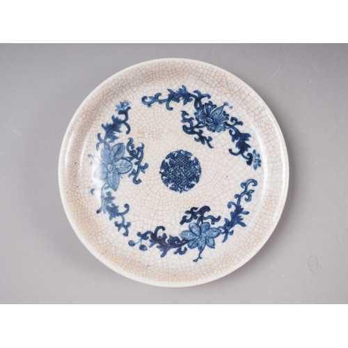 53 - A Chinese crackle glaze shallow dish, decorated in underglaze blue with floral motifs, 8 1/2