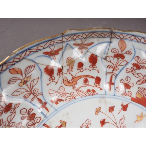 59 - An Imari shallow dish (cracks), 1