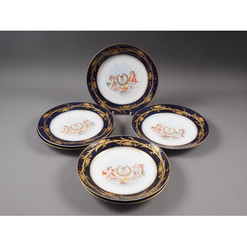 8 - Six Sevres plates with central putti decoration and blue and gilt decorated borders, 9 1/2