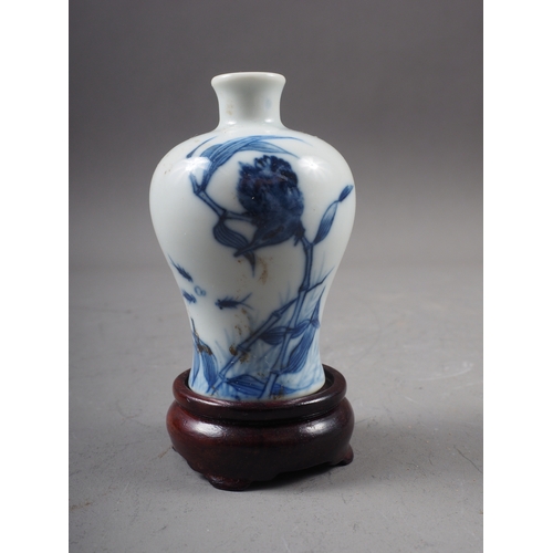 41 - A Chinese blue and white porcelain miniature vase, decorated bird and fish, six-character mark to ba... 