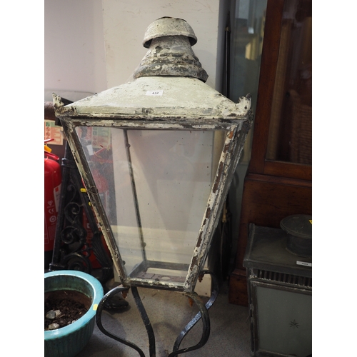 432 - A late 19th century copper street light with four glazed panels and cast iron wall bracket, 40