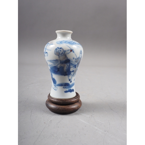 51 - A Chinese blue and white porcelain vase, decorated farmers and warriors, four-character mark to base... 