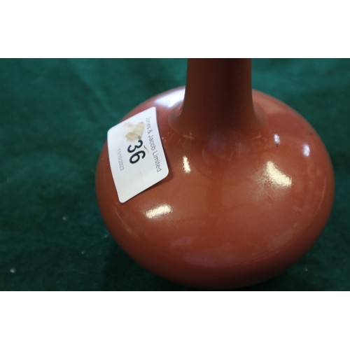 36 - A Chinese sang de boeuf sprinkler vase, on hardwood base, 6 3/4