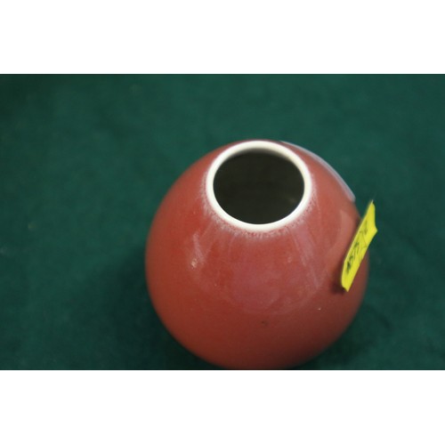 36 - A Chinese sang de boeuf sprinkler vase, on hardwood base, 6 3/4