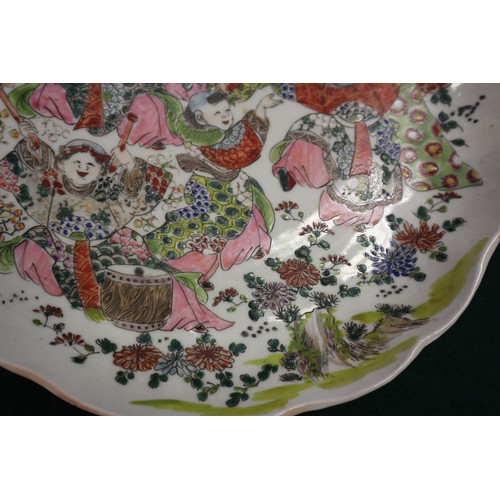 45 - A Chinese famille verte porcelain shallow dish, decorated four boats and figures, four-character mar... 