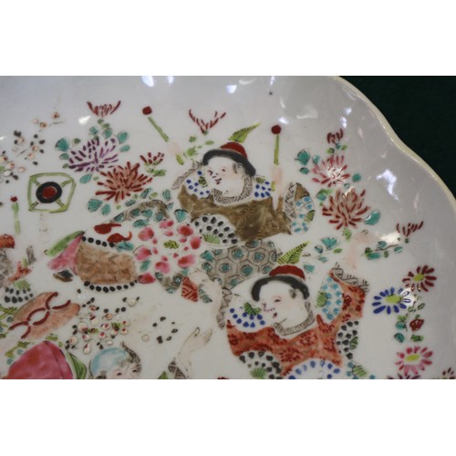 45 - A Chinese famille verte porcelain shallow dish, decorated four boats and figures, four-character mar... 