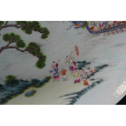 45 - A Chinese famille verte porcelain shallow dish, decorated four boats and figures, four-character mar... 