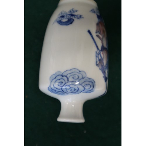 43 - A Chinese blue and white and iron red porcelain miniature vase, decorated single figure, four-charac... 