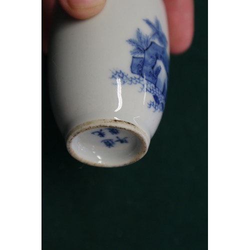 43 - A Chinese blue and white and iron red porcelain miniature vase, decorated single figure, four-charac... 