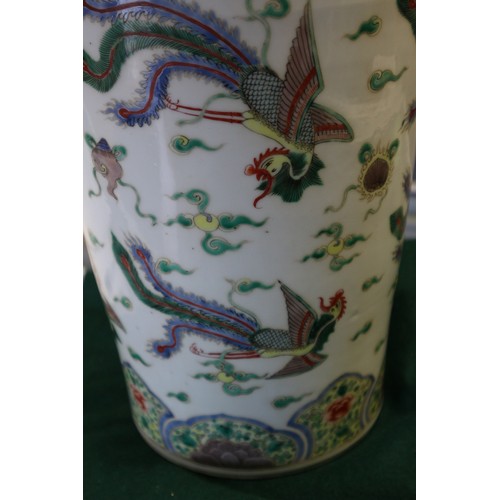 35 - A Chinese famille vert vase with flared rim and tapering body, decorated phoenix and clouds, on hard... 