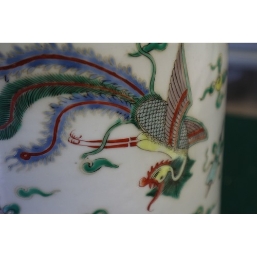 35 - A Chinese famille vert vase with flared rim and tapering body, decorated phoenix and clouds, on hard... 