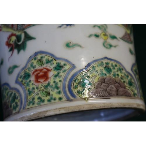 35 - A Chinese famille vert vase with flared rim and tapering body, decorated phoenix and clouds, on hard... 