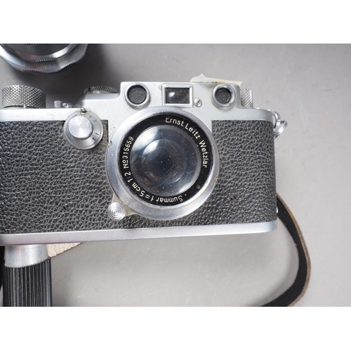 162 - A Leica DRP rangefinder camera, No 666946, with Sumar 50mm f1.2 lens, No 315659, and hand grip