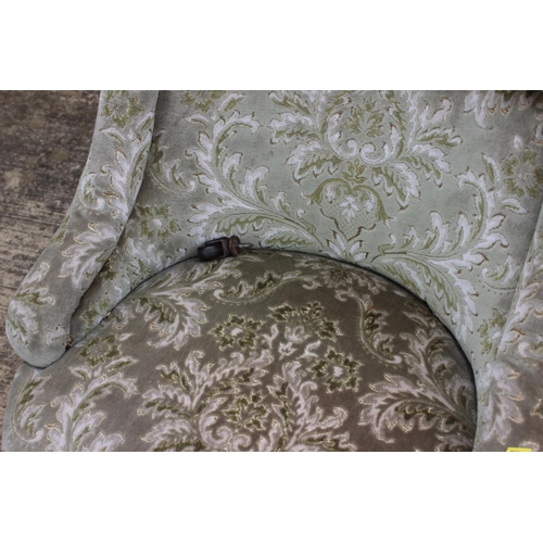 506 - A Victorian low tub seat chair, button upholstered in a cut velour, on turned supports