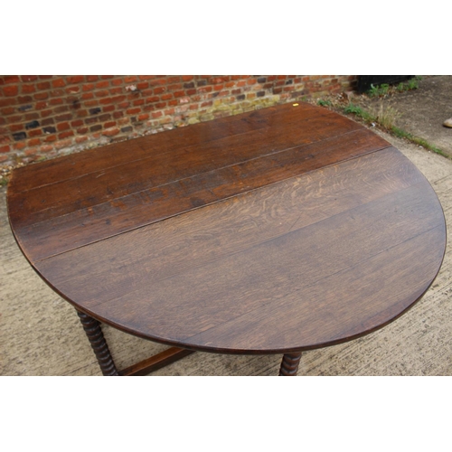 508 - A 19th century oak drop leaf dining table, on bobbin turned and stretchered supports, 50