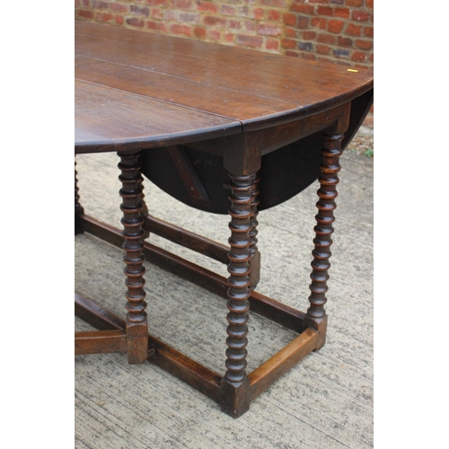 508 - A 19th century oak drop leaf dining table, on bobbin turned and stretchered supports, 50