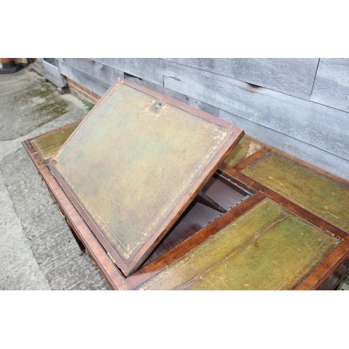 518 - A late 19th century mahogany writing desk, with tooled leather adjustable writing surface, over two ... 