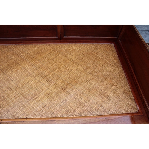 520 - A Chinese hardwood (huanghuali) bed, with woven bamboo seat, on scroll supports, 77