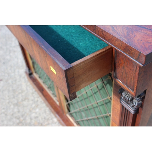 523 - A Regency rosewood chiffonier, fitted frieze drawer over two brass lattice panel doors, on block bas... 