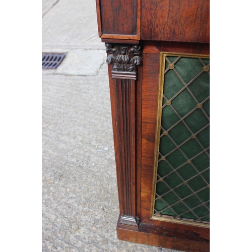 523 - A Regency rosewood chiffonier, fitted frieze drawer over two brass lattice panel doors, on block bas... 