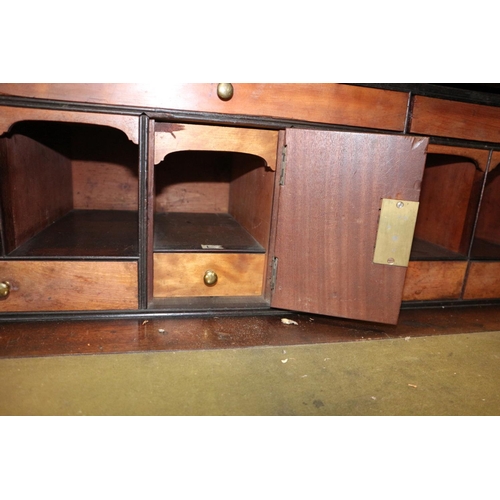 526 - A Georgian mahogany satinwood box and ebony strung secretaire bookcase, the upper section enclosed a... 