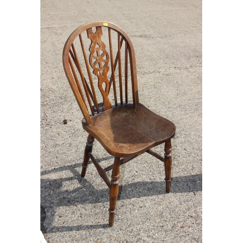 633 - A Sheraton Revival carved mahogany elbow chair with shield-shape back, on square taper supports, a W... 