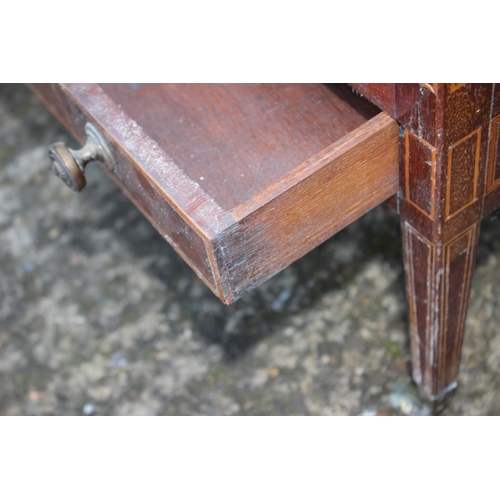 634 - An Edwardian mahogany and box line inlaid canterbury, fitted one drawer, on square taper castored su... 