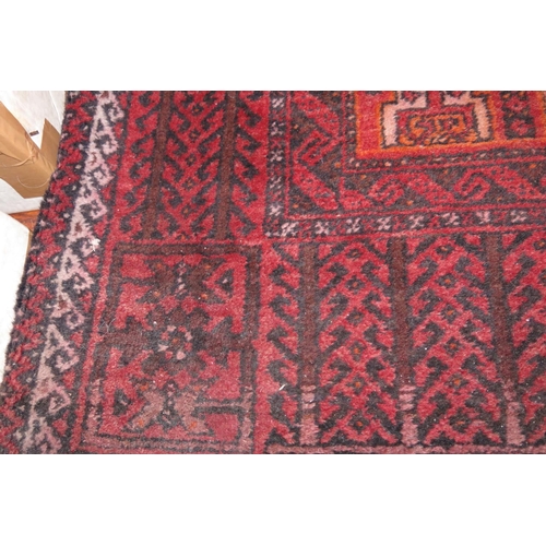 673 - A Caucasian tribal rug with geometric design, animals and horses to centre ground and tree borders i... 