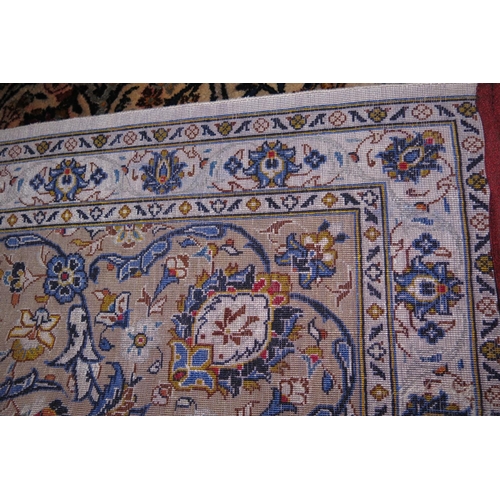 675 - A Kashan silk rug with all-over foliate scroll design and multi boarders in shades of blue, cream, r... 