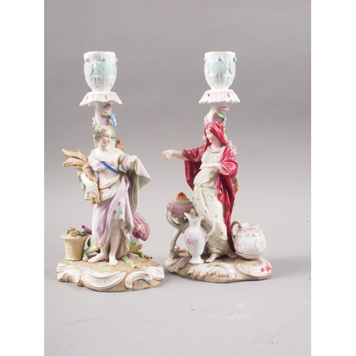 10 - Two 19th century German candlesticks, harvester and merchant, 8 3/4