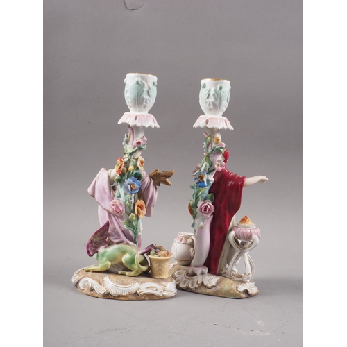 10 - Two 19th century German candlesticks, harvester and merchant, 8 3/4