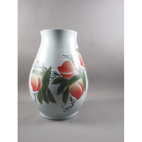 111 - A Chinese porcelain baluster vase, decorated peaches and script, 19 1/2